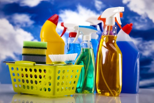 Office cleaning team sanitising desks and shared surfaces in London