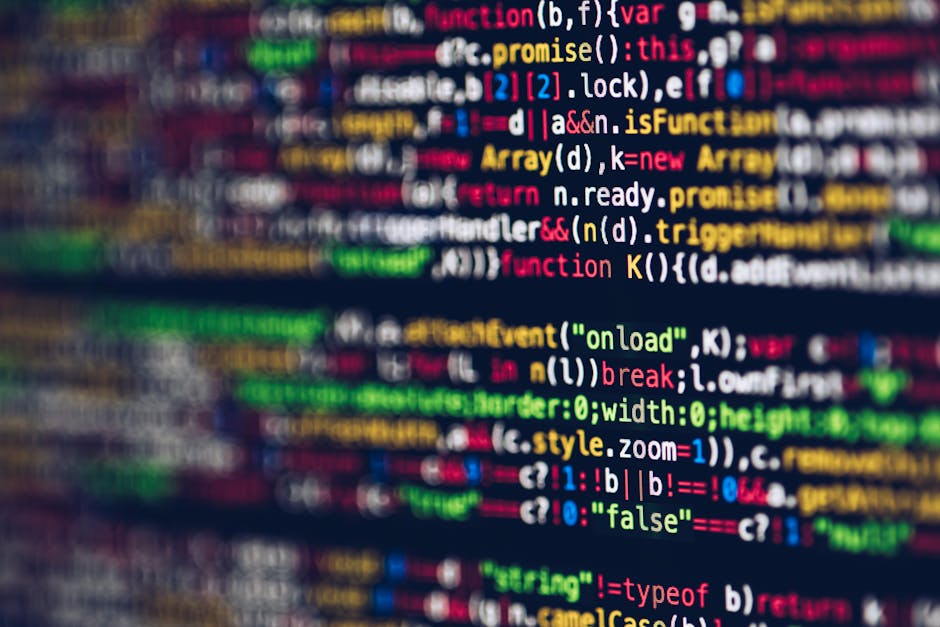 Close-up of a computer screen displaying colorful lines of code with syntax highlighting, including functions, variables, and tags. The code is layered and blurred with a focus on the vibrant colors a
